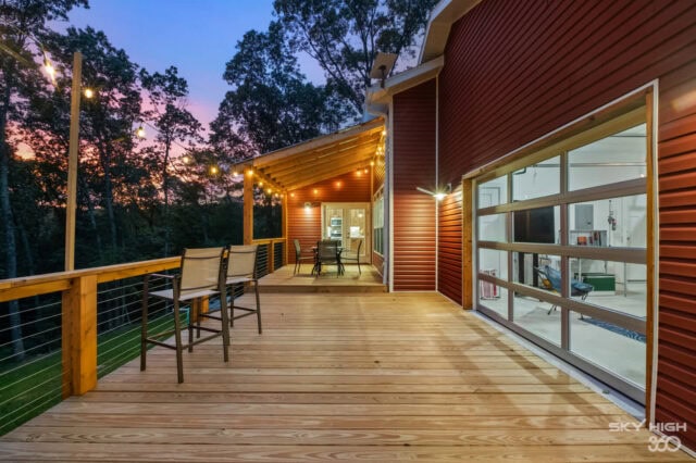 Enjoy the scenic outdoor deck at Black Bear Cabin, perfect for relaxing and taking in the Back 40 Tr.