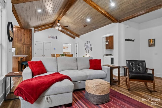 Cozy living room in Black Bear Cabin with vaulted wooden ceiling and modern decor.