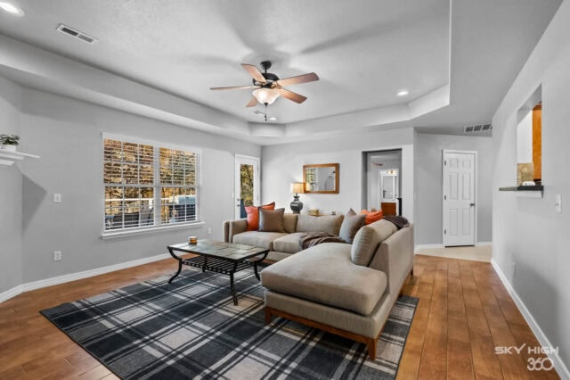 Relaxing living room with modern decor, large windows, and cozy seating in a vacation rental near Oz.
