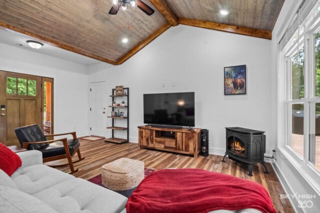 Cozy living room inside Black Bear Cabin with modern amenities and scenic views in Bella Vista.