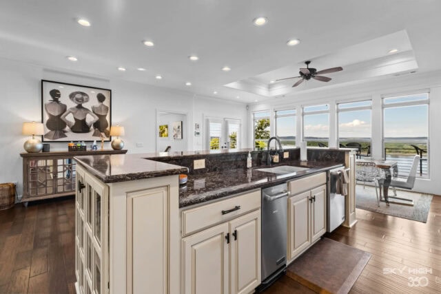 A comfortable, modern kitchen with large windows offering scenic lake views at Rivercliff Ridgehouse.