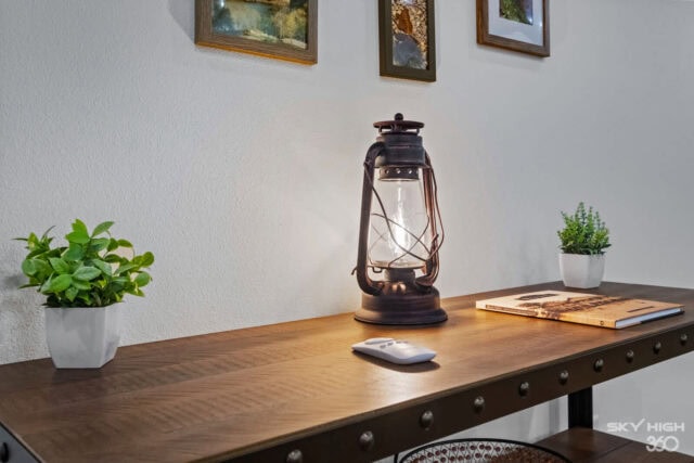 Black Bear Cabin vacation rental decor with lantern and potted plants in Bella Vista.