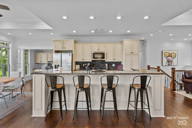 Enjoy modern kitchen with white cabinets and black granite countertops at Rivercliff Ridgehouse, a B.