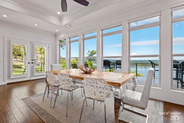 Bright dining area with large windows overlooking Beaver Lake in Rogers, AR.
