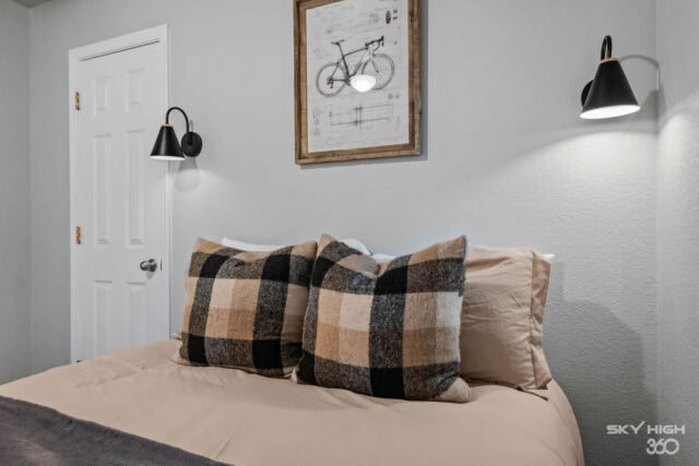 Cozy bedroom with modern decor, perfect for a relaxing stay near Back 40 & Blowing Springs in Bella.
