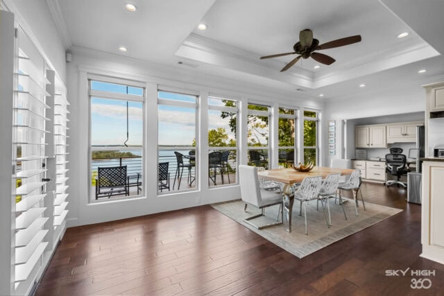 Bright lakeside dining area with large windows and scenic views at Rivercliff Ridgehouse, Beaver Lak.