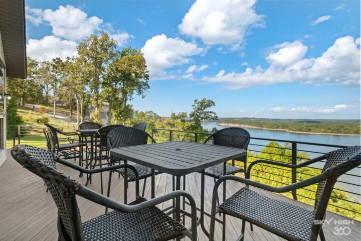 Elegant outdoor deck with lake views at Rivercliff Ridgehouse vacation rental in Rogers, AR. Perfect.