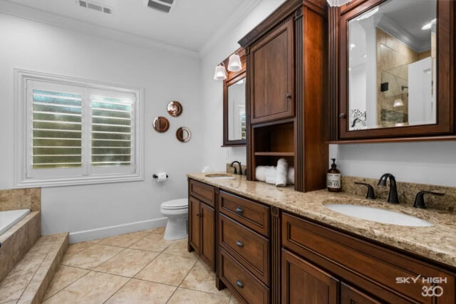 Spacious bathroom with double vanity, granite countertops, and modern fixtures in a luxury vacation.
