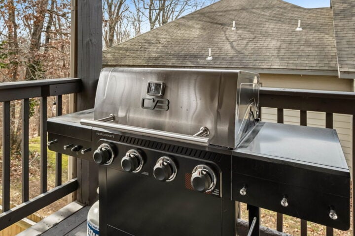 Grill on a balcony at The Witherby Woodland Retreat, Bella Vista Vacation Rental near Back 40 Trails.