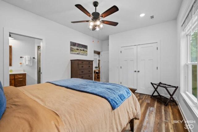 Cozy bedroom in Black Bear Cabin with modern amenities and natural light, perfect for a relaxing vac.