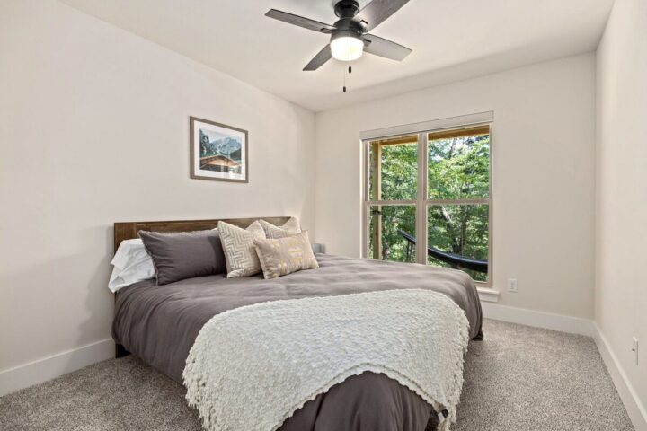 Relaxing bedroom in a cozy vacation rental near Back 40 Trails, perfect for outdoor adventure stays.