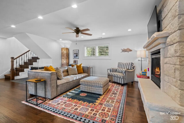 Cozy living room in Rivercliff Ridgehouse with fireplace and lake views in Rogers, AR.