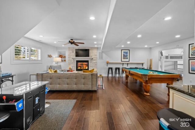 Cozy indoor game room with pool table, fireplace, and entertainment area at Rivercliff Ridgehouse, B.