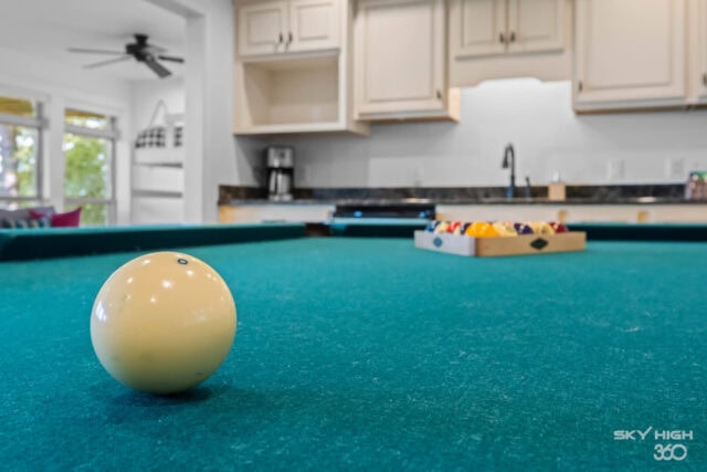 Relaxing game room with pool table and scenic views at Rivercliff Ridgehouse vacation rental in Roge.