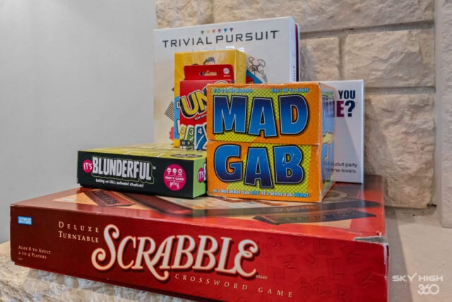 Board games including Scrabble, Trivial Pursuit, and Mad Gab for family fun at Rivercliff Ridgehouse.
