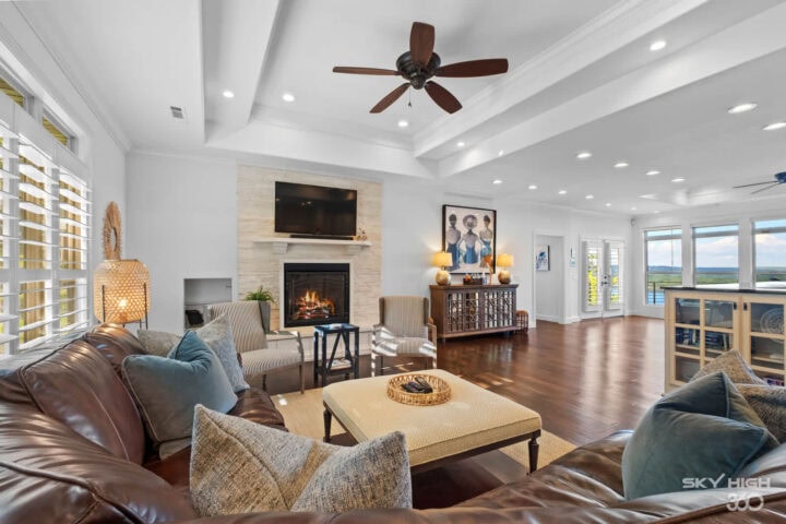 Cozy living room with fireplace and modern decor at Rivercliff Ridgehouse, a Beaver Lake view vacati.