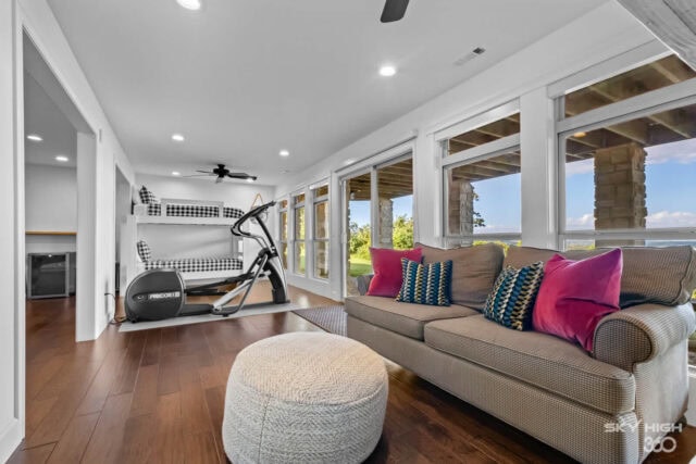 Bright living room with large windows overlooking Beaver Lake at Rivercliff Ridgehouse vacation rent.