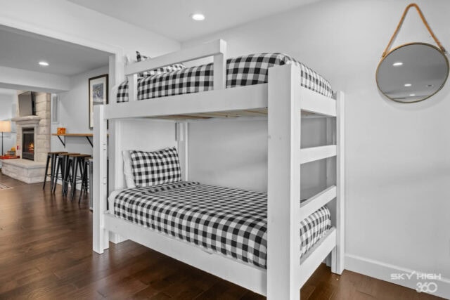 Bunk beds with black and white checkered bedding in a modern vacation rental home.