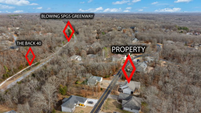 Scenic aerial view of The Witherby Woodland Retreat near Back 40 Trails in Bella Vista, Arkansas.