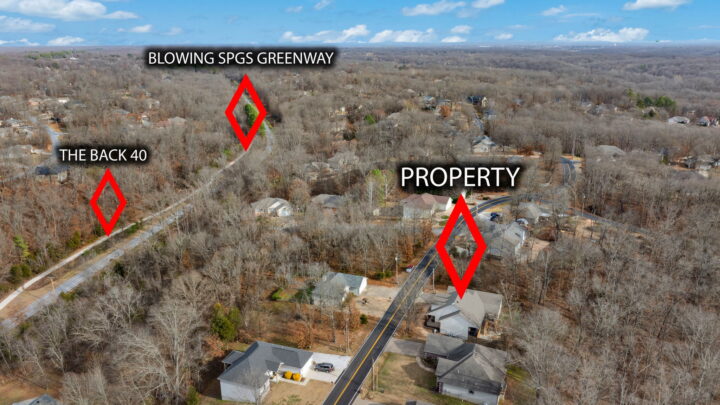 Scenic aerial view of The Witherby Woodland Retreat near Back 40 Trails in Bella Vista, Arkansas.