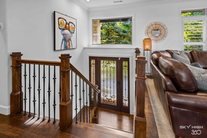 Relaxing interior view of Rivercliff Ridgehouse with large windows and cozy decor in Rogers, AR.