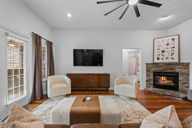 Cozy living room with fireplace and modern decor at The Witherby Woodland Retreat.
