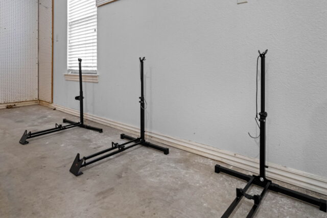 Adjustable clothing racks in a cozy rental home at The Witherby Woodland Retreat near Back 40 Trails.