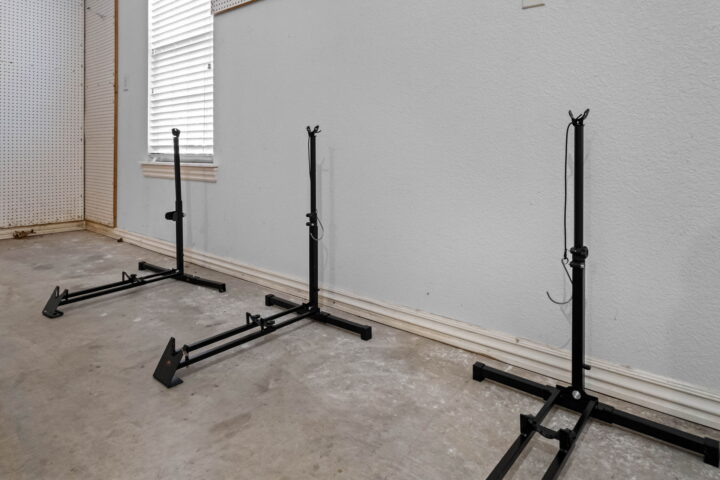 Adjustable clothing racks in a cozy rental home at The Witherby Woodland Retreat near Back 40 Trails.