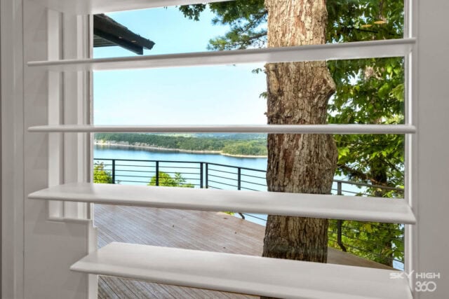 A lush view of Beaver Lake from the Rivercliff Ridgehouse vacation rental in Rogers, AR.