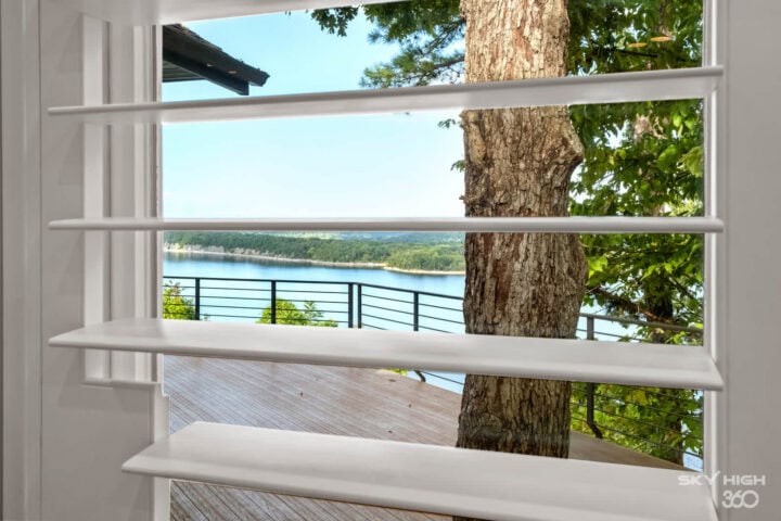 A lush view of Beaver Lake from the Rivercliff Ridgehouse vacation rental in Rogers, AR.
