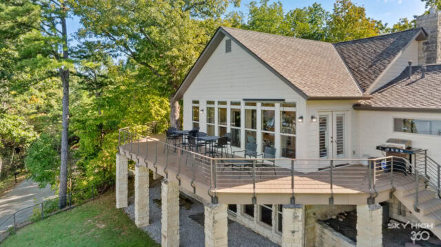 A lush lakeside house with a spacious deck overlooking Beaver Lake in Rogers, AR.