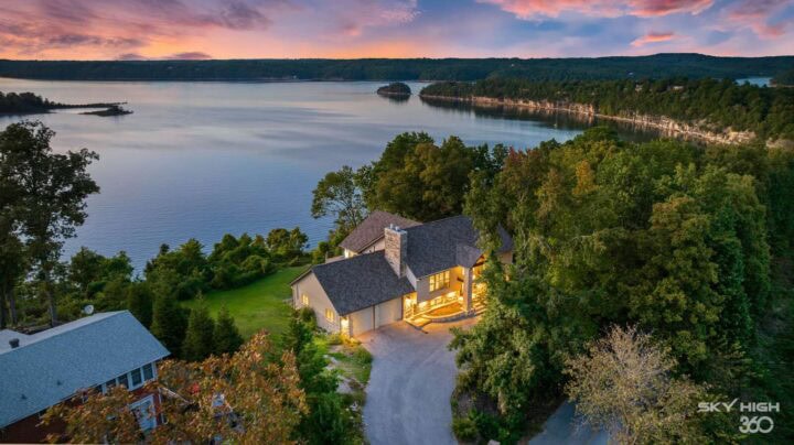 Rivercliff Ridgehouse with Beaver Lake view at sunset in Rogers, AR.