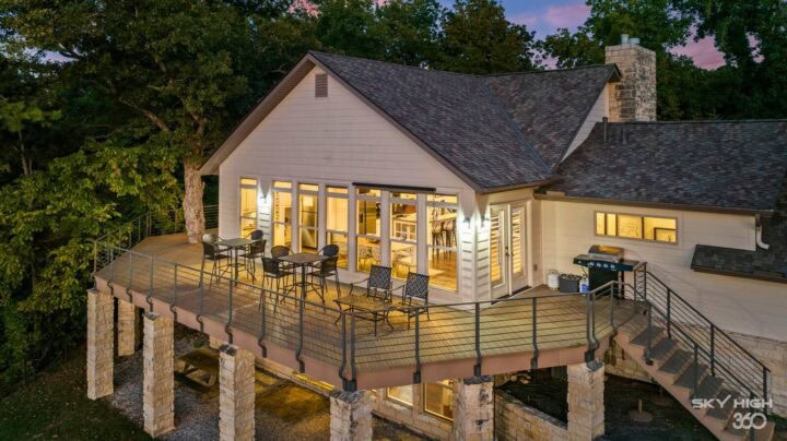 Spacious lakeside vacation rental with large deck and scenic views in Rogers, AR.