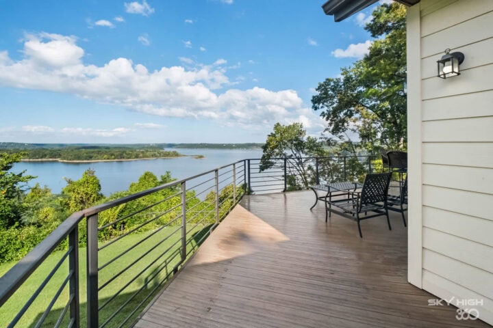 Spacious balcony with lake view at Rivercliff Ridgehouse vacation rental in Rogers, AR.