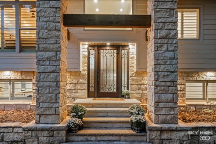 Beautiful stone front porch of Rivercliff Ridgehouse vacation rental in Rogers, AR.