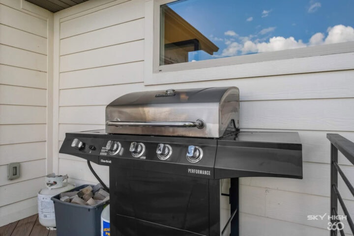 Grill on a porch at Rivercliff Ridgehouse vacation rental in Rogers, AR.