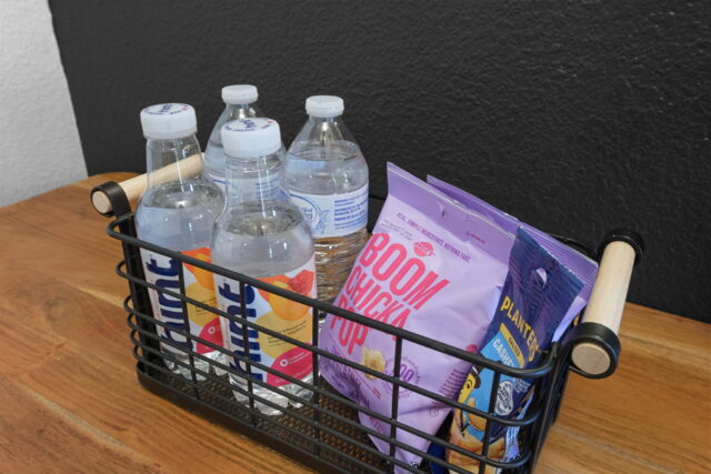 Stay hydrated with bottled water and snacks at The Witherby Woodland Retreat near Back 40 Trails. Pe.