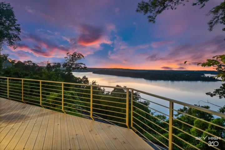 Scenic view of Beaver Lake from Rivercliff Ridgehouse balcony at sunset.
