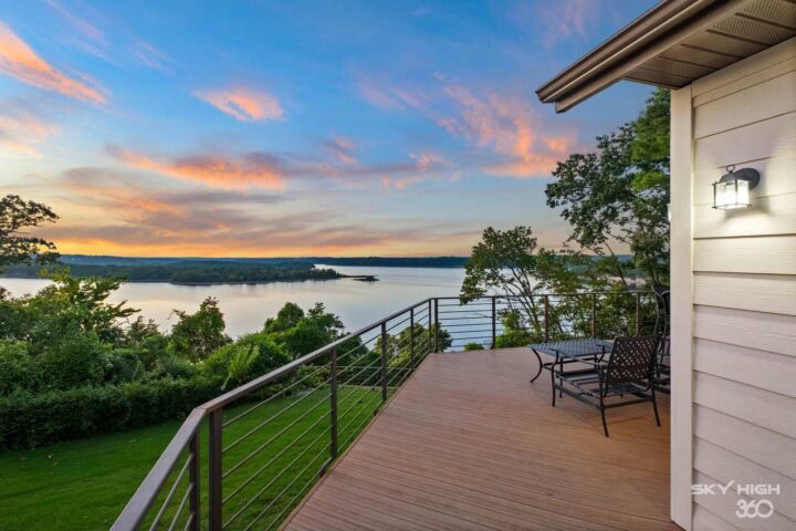 Relaxing lake view from the Rivercliff Ridgehouse balcony in Rogers, AR, perfect for a Beaver Lake v.